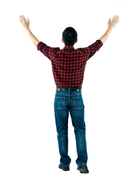 istock Rear view of man arms outstretched 980642352