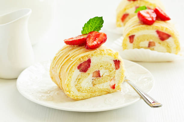 istock A piece of biscuit roll with cream and strawberry. 980642870