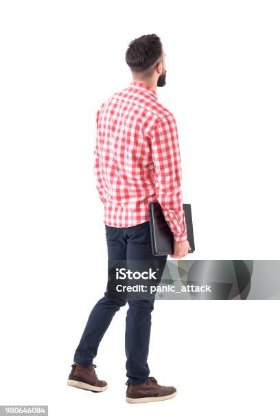 Back View Of Smart Casual Man With Laptop Walking And Looking Up Watching Copyspace Stock Photo - Download Image Now