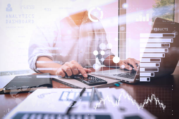 istock business documents on office table with smart phone and digital tablet and graph business diagram and man working in the background 980646990