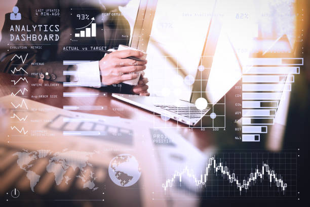 istock business documents on office table with smart phone and digital tablet and graph business diagram and man working in the background 980647176