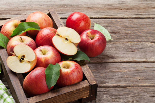 istock Red apples in wooden box 980651056