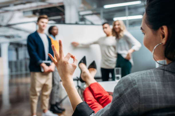 istock managers making presentation for lady boss while she showing okay sign 980651082