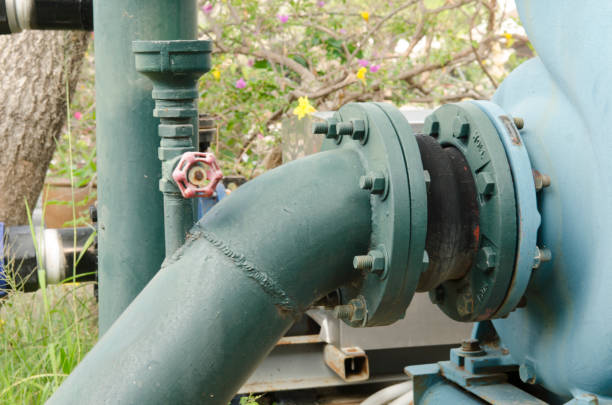 istock water pumping on the ground field 980655268