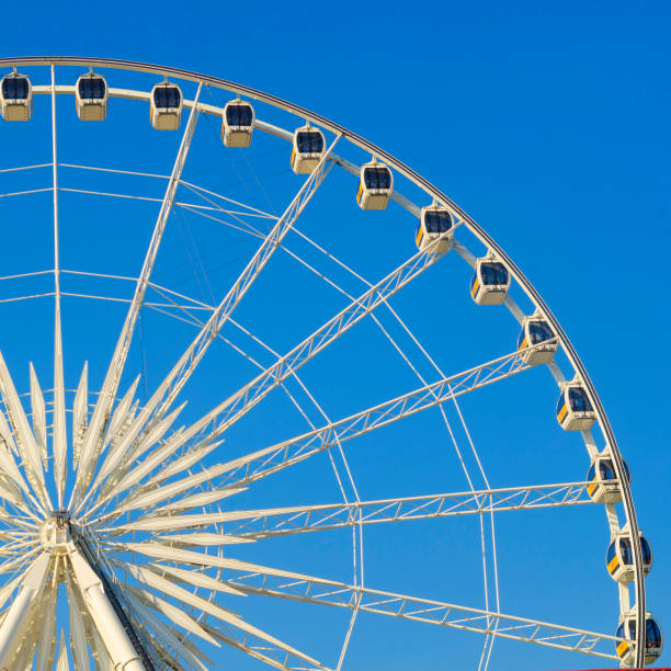 istock Beautiful large Ferris wheel. And the blue sky. 980655520