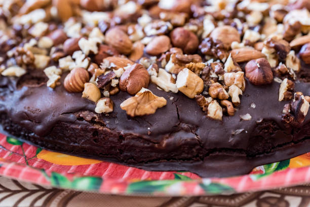 istock Close up homemade chocolate cake with walnuts 980655952