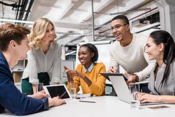 istock young happy managers working together at conference hall in modern office 980656090