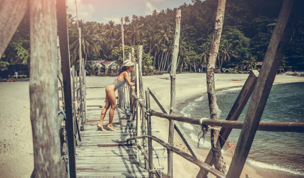 istock Woman posing on the beach 980677474