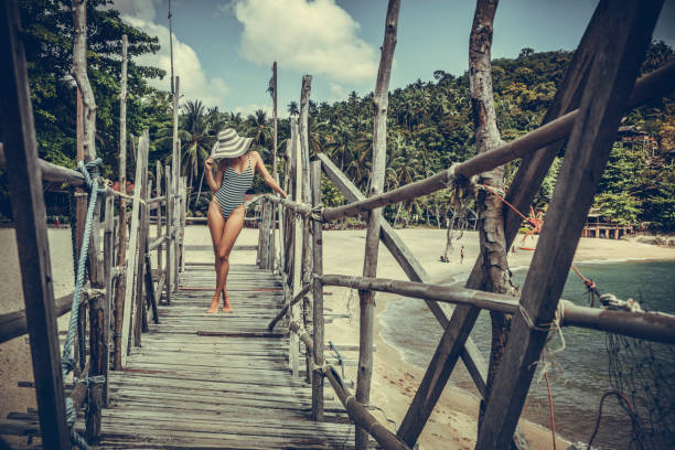 istock Woman posing on the beach 980677486