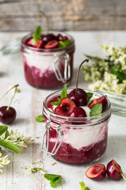Cherry Mousse, Mascarpone, Cherry Compote, Mint Cherry Mousse, Mascarpone, Cherry Compote, Mint compote photos stock pictures, royalty-free photos & images