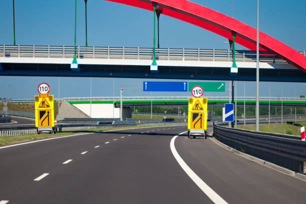 istock Highway interchange with bridge and sun on the background 980689994