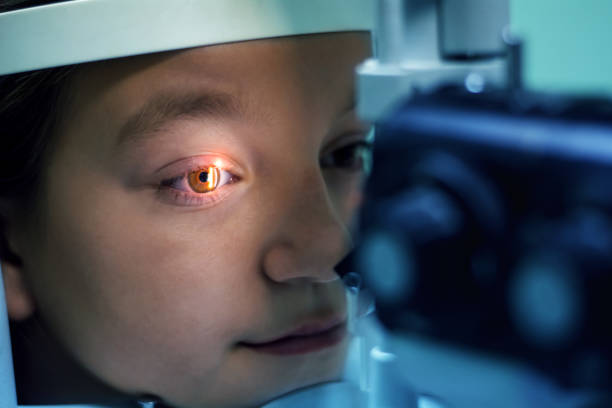 Girl Undergoing Eye Examination stock photo