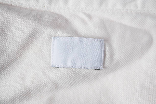 istock White blank laundry care clothes label on cotton shirt 980702406