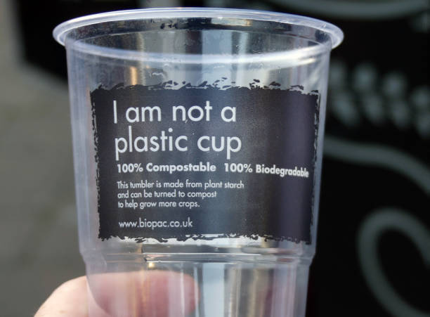 An eco friendly plastic cup, that is made form an alternative material. Relevant to plastic waste and pollution An eco friendly plastic cup, that is made form an alternative material. Relevant to plastic waste and pollution biodegradable photos stock pictures, royalty-free photos & images