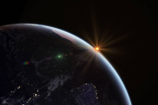 istock Sunrise in space with earth, solar energy concept. 980716890
