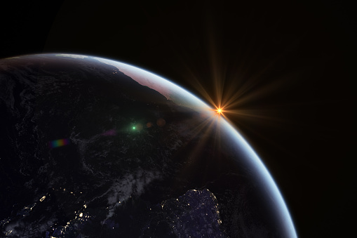 Sunrise in space with earth, leans flare, solar energy. https://www.nasa.gov/topics/earth/images/index.html Software: Photoshop