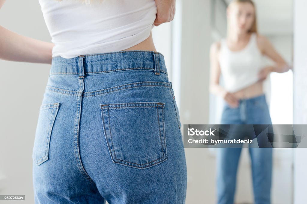 Woman checking her body Women Stock Photo