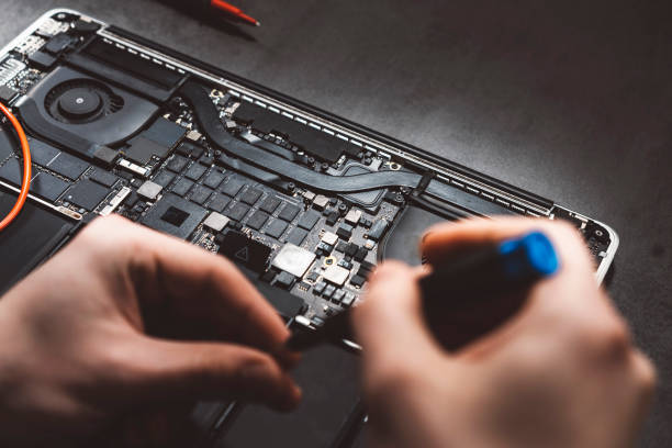 istock Repairman disassemble laptop motherboard 980728668