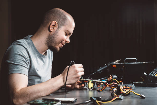 istock Repairing circuit board in his workshop 980729272