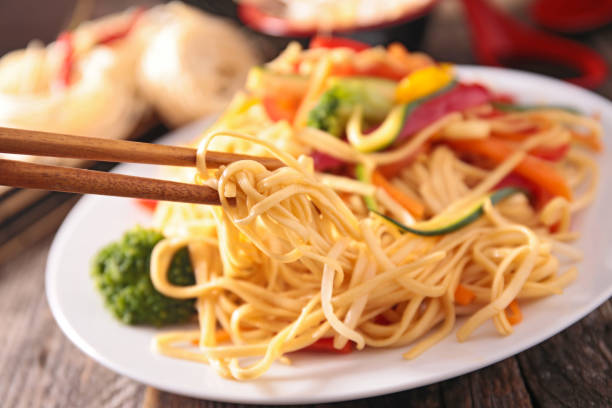 istock chinese noodles and vegetable 980730612