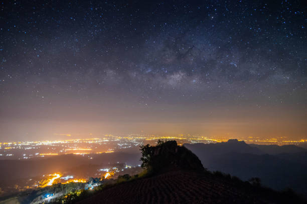 istock night landscape mountain and milky way  galaxy background , thailand , long exposure , low light 980730644