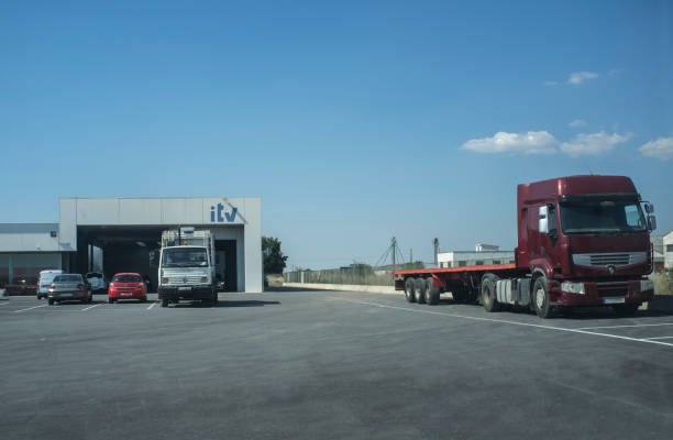 ITV Facilities or Inspection Station in Spain Badajoz, Spain - 19th june, 2018: ITV Facilities or Inspection Station in Spain. Some vehicles parked all around itv photos stock pictures, royalty-free photos & images