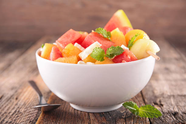 fruit salad in bowl fruit salad in bowl fruit salad stock pictures, royalty-free photos & images