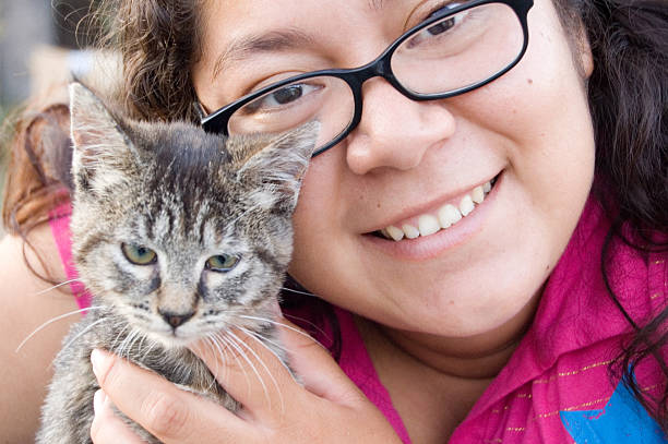 istock Young Hispanic Female Vet Holding a Kitten 98073857