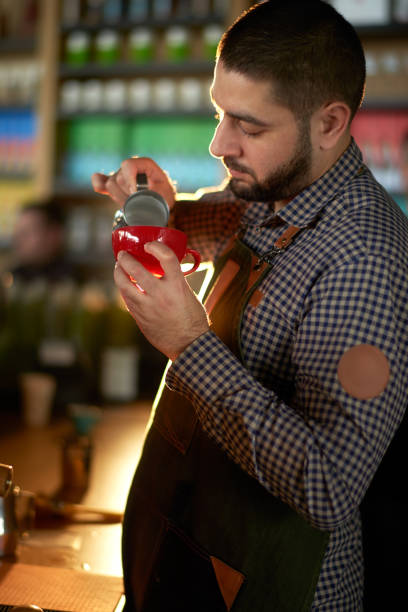istock Barista in coffee shop 980739224