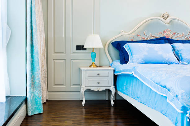 istock Bed and lamp in the bedroom 980748564