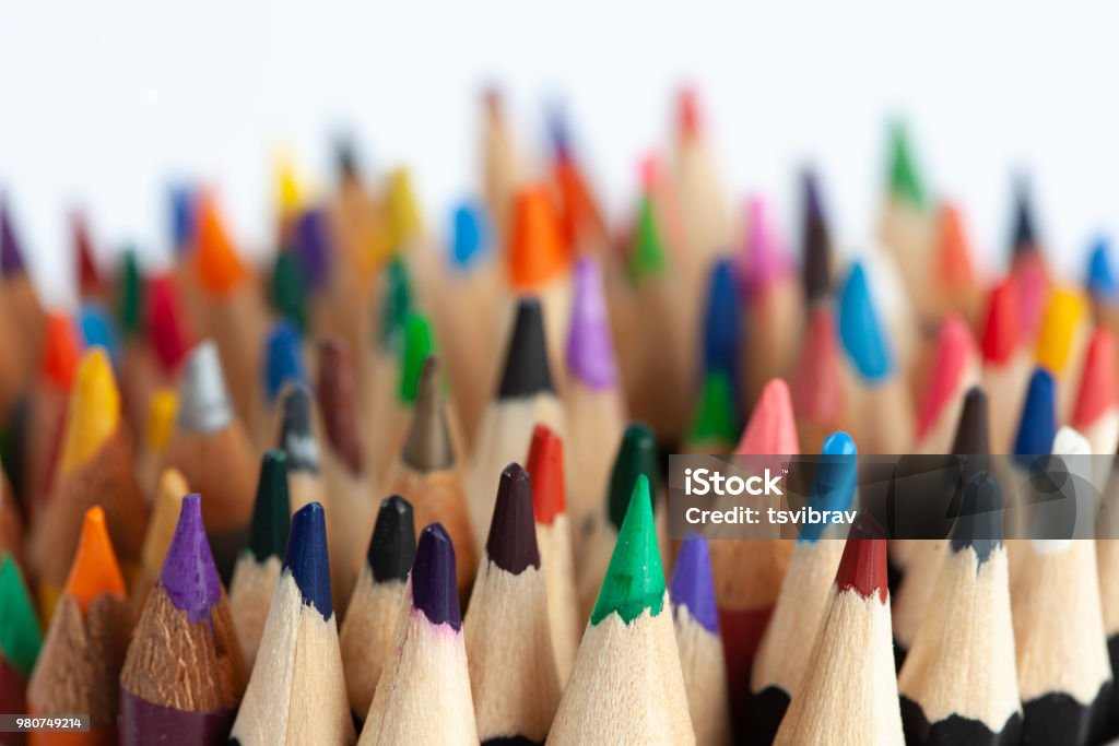 Many rows of sharp colored pencils with focus on foreground School Supplies Stock Photo