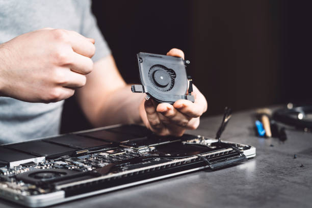 istock Cooling fan repair on laptop 980753122