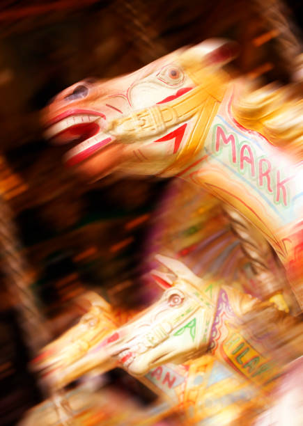 PAINTED WOODEN HORSES ON VICTORIAN FAIRGROUND RIDE