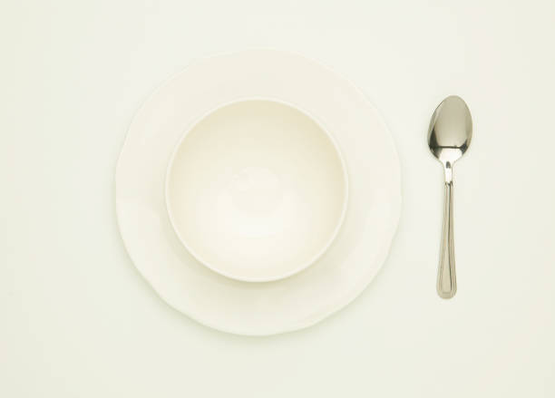 istock WHITE BOWL AND PLATE WITH SPOON 980755458