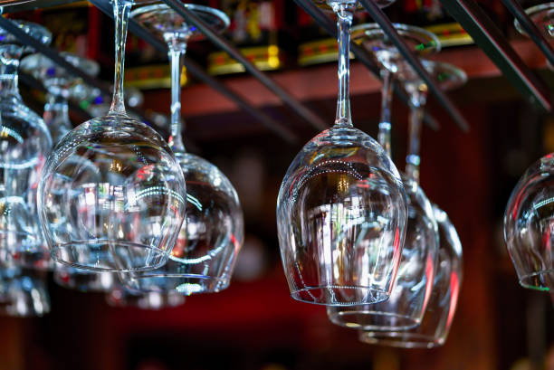 istock Wine glasses hanging on a rack in a bar. 980771570