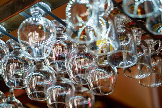 istock Wine glasses hanging on a rack in a bar. 980771582
