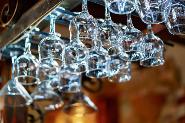 istock Glasses hanging over bar rack. 980771608