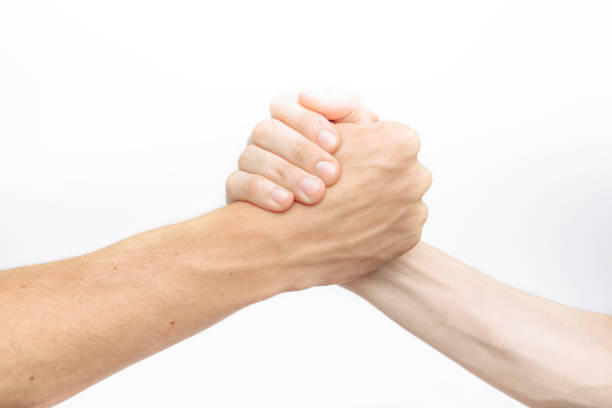 istock Hand holding, struggle between two, isolated on white background, for advertising, text insertion 980772548