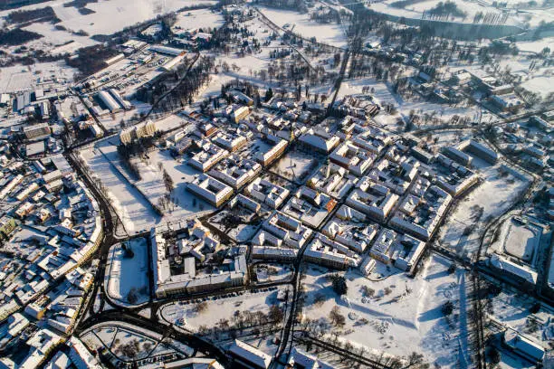 KARLOVAC - The Renaissance star-shaped city at a border and a crossroads
 
The city of Karlovac was built on the edge of the Pannonian Plain in times when the border of the Ottoman and Habsburg Empires was formed along the Rivers Kupa and Korana, southwestern tributaries of the Danube basin. It is situated near their confluence and at the edge the Kupa's waterway. Located about a hundred kilometers from the Adriatic coast, Karlovac became all the more important as a significant thoroughfare, because some of the previous routes between the coast and inland, often based on ancient  routes, had been cut off.
Photo taken with drone in cold winter morning.