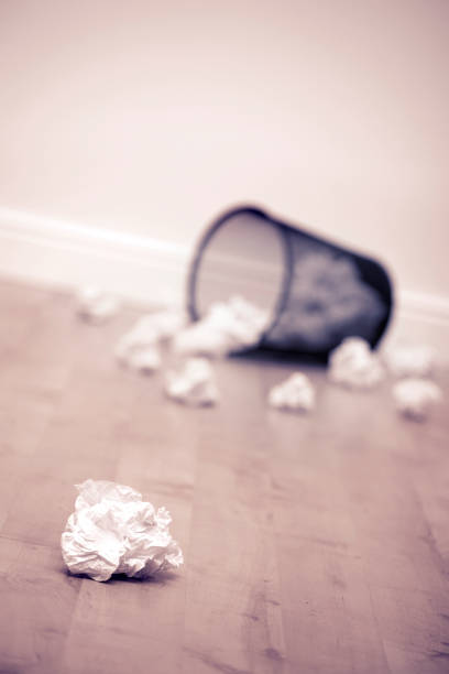 istock LITTER BIN AND WASTE PAPER ON FLOOR 980785352