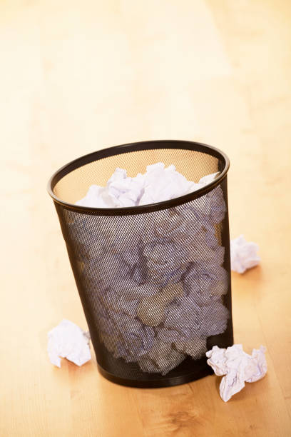 istock WASTE PAPER BIN FULL OF PAPER 980786898