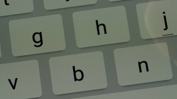 istock Close-up view fingers tapping keypad of tablet and writing message on touch screen 980787074