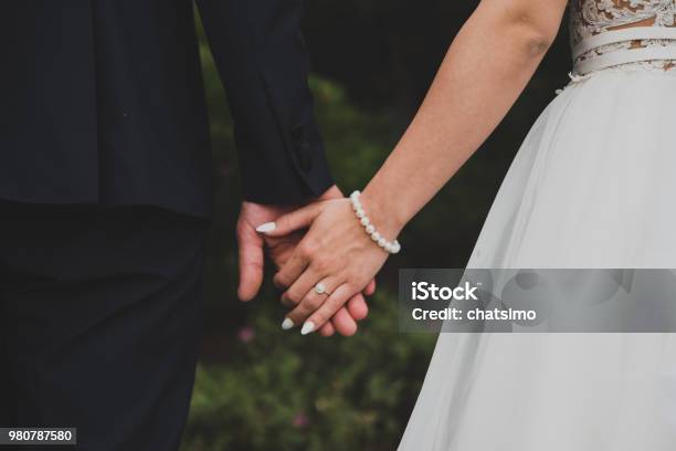 Young Married Couple Holding Hands Stock Photo - Download Image Now - Wedding, Engagement, Married
