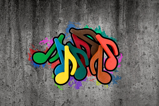 Graffiti of colorful music notes on the wall