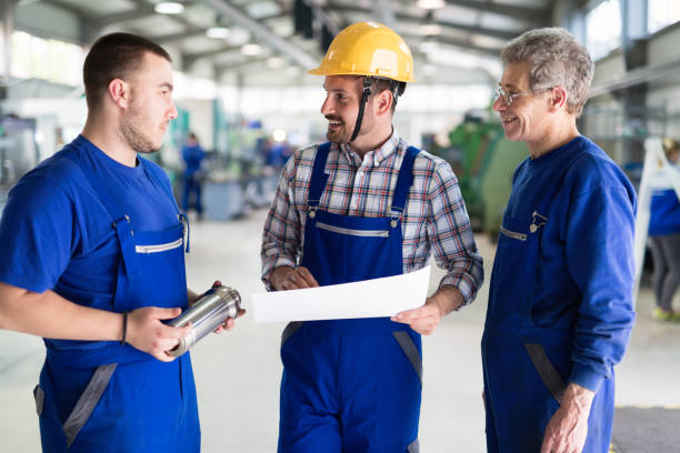 istock Team Of Engineers Having Discussion In Factory 980791836