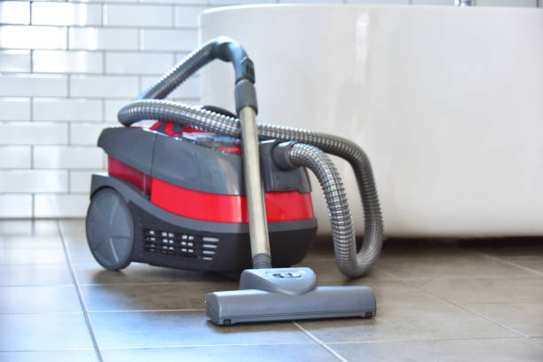 istock Canister vacuum cleaner for home use on the floor 980796058
