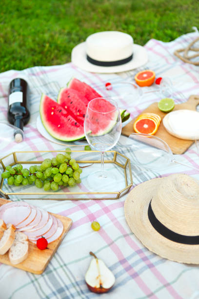 istock Picnic with white wine on green grass 980796074