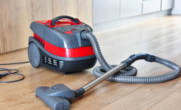 istock Canister vacuum cleaner for home use on the floor 980796242