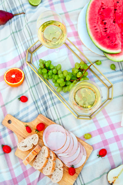 istock Picnic with white wine on green grass 980796396