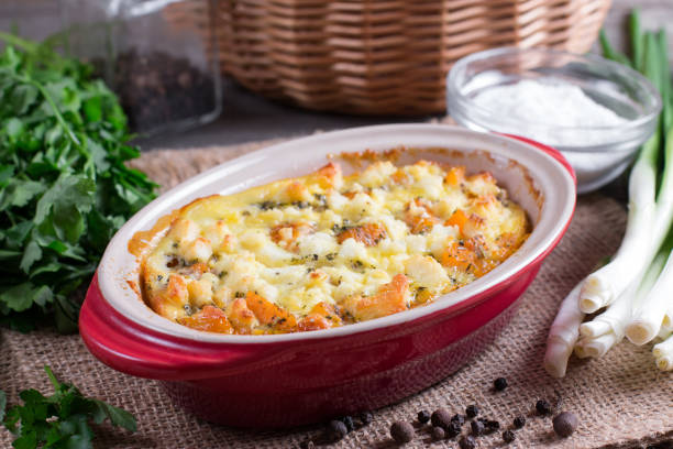 istock Baked casserole with a pumpkin on a wooden background 980804466